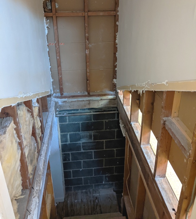 Stairwell with some drywall removed