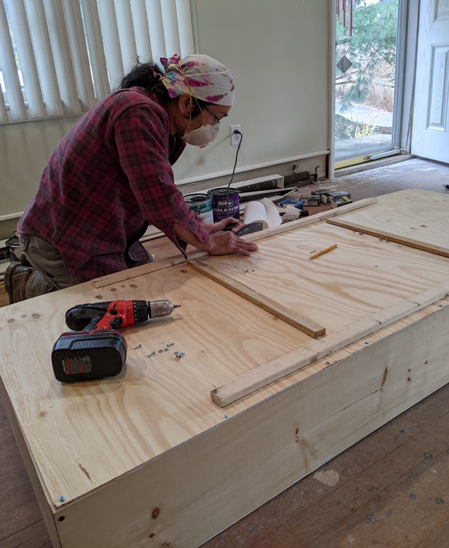 Me working on the back of the bookshelf