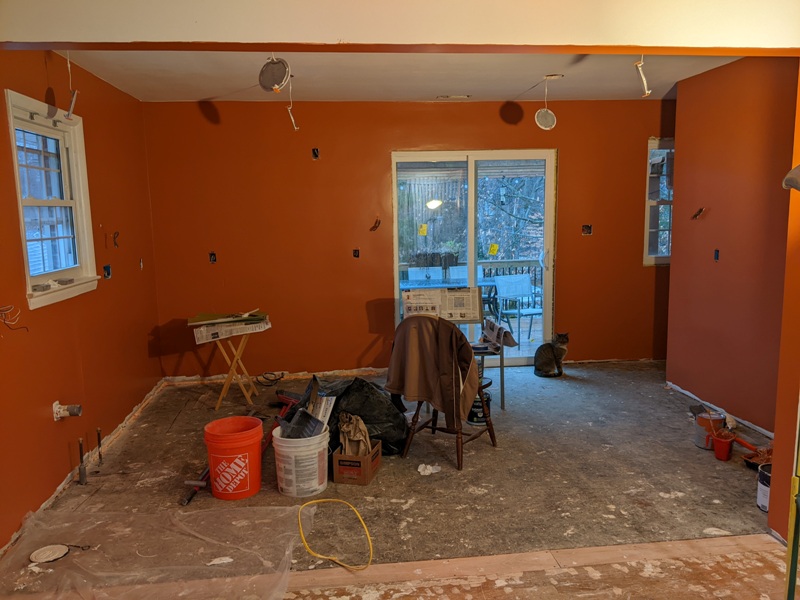 Kitchen with a fresh coat of Valspar Faded Clay paint and Chester (our cat) near the slding glass door that leads to the deck