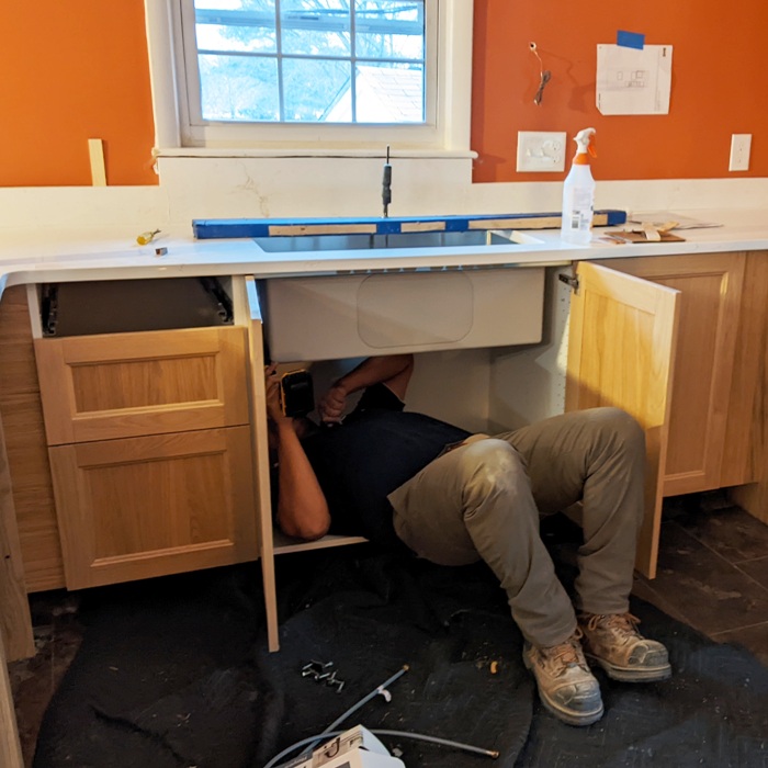 Guy installing sink