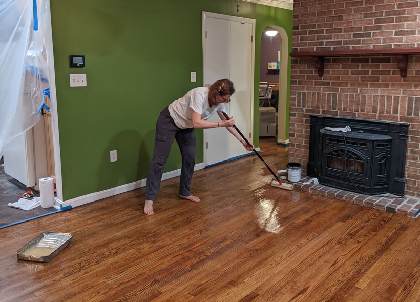 Norma applying another coat of polyurethane