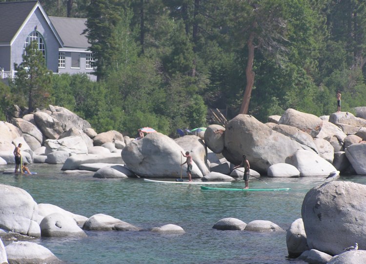 Paddleboarders and rocks