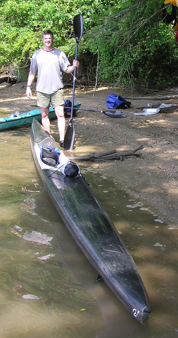 Brian standing with his Epic V10 surf ski