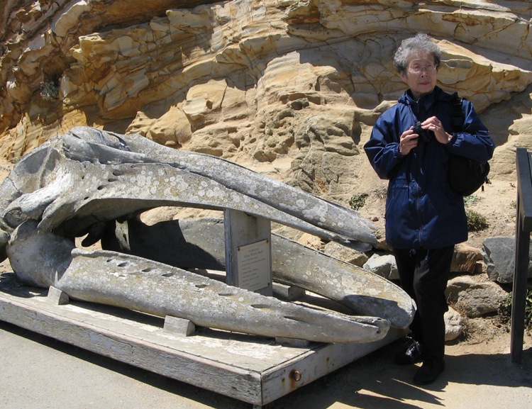 Mom next to whale skull