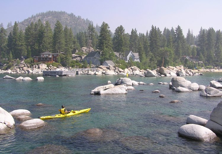 A yellow kayak with smoky skies