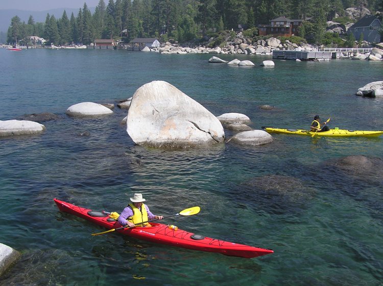 Red kayak with yellow behind