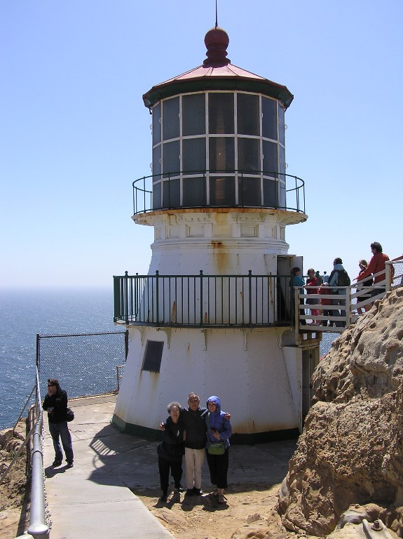 Mom, Dad, and Norma standing in front of the lighthouse