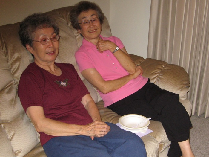 Mom and Aunt Kay sitting on couch