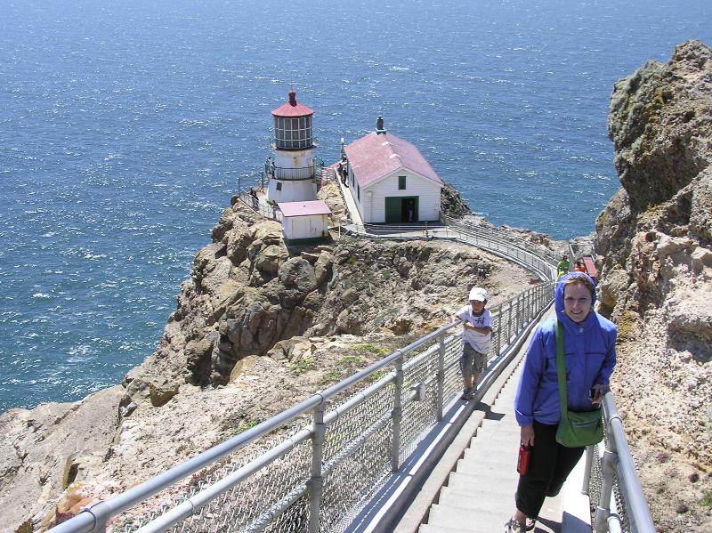 Norma on steps leading down to the lighthouse