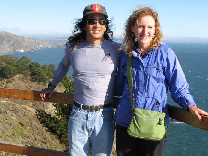 Norma and I smiling with the ocean behind