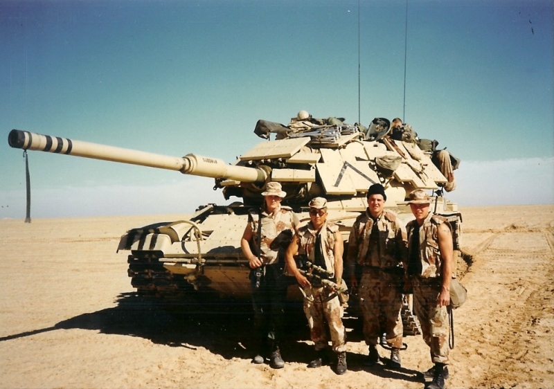 Posing in front of a tank