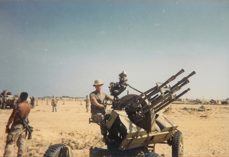 Marine seated at quad anti-aircraft gun