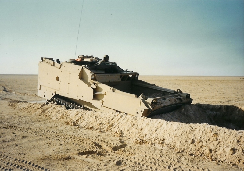 Bulldozer digging a vehicle pit