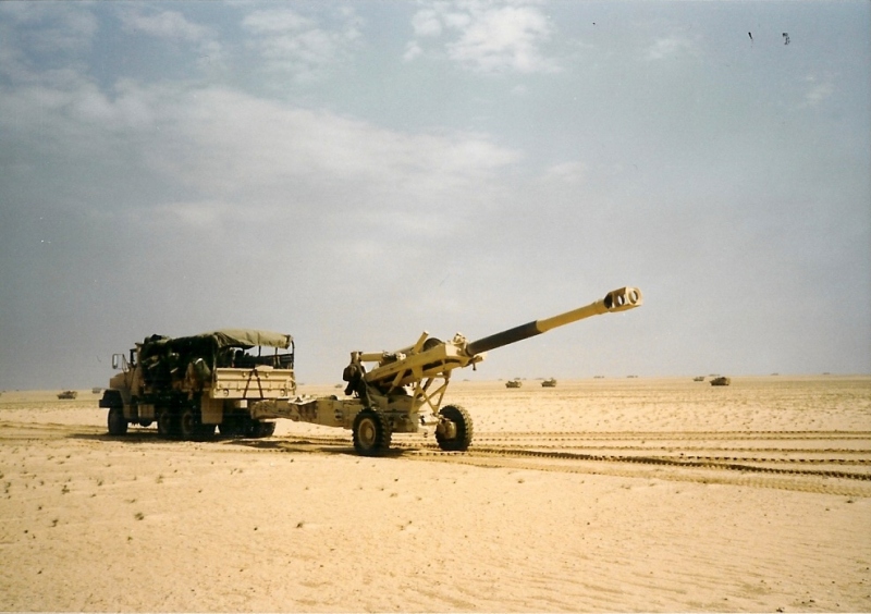 Truck towing artillery