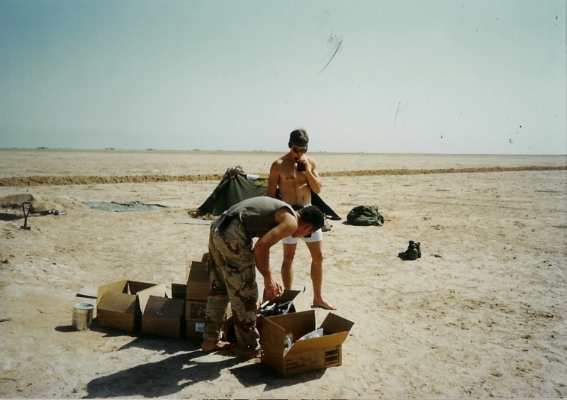 Belford and Beyea looking through MRE boxes