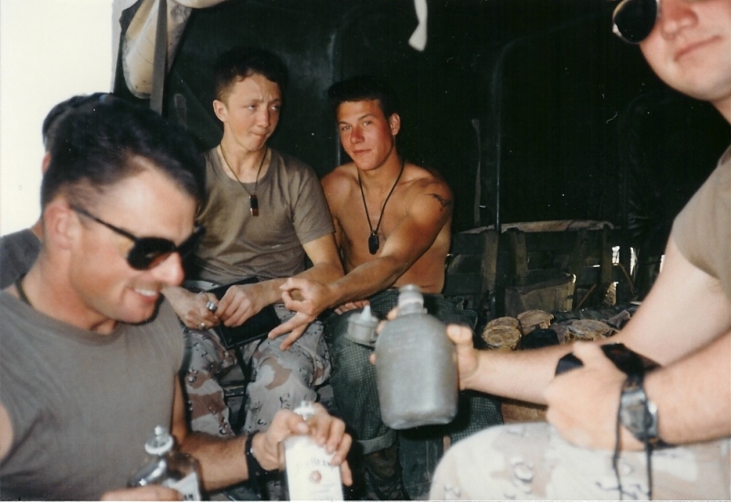 Group shot at the back of the Humvee