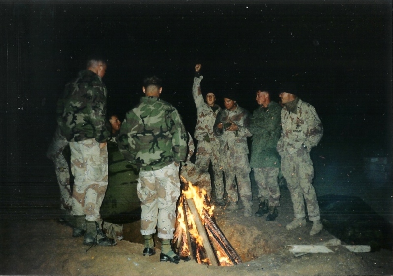 Marines gathered around the fire