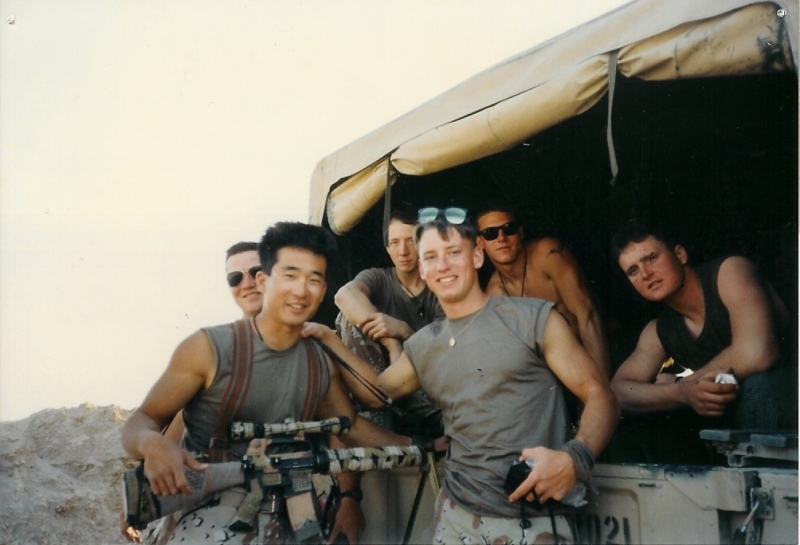 Group photo at the back of the Humvee