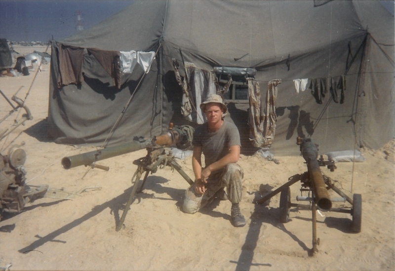 Maloney flanked by what look like recoilless rifles