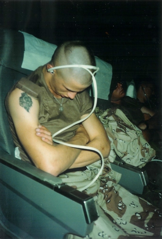 Sleeping Marine wearing headphones