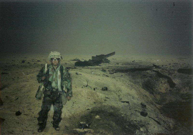 Me standing by the remains of a blown-up BMP