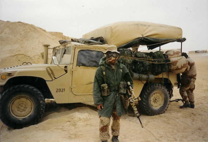 Me dressed for a sandstorm in front of a Humvee