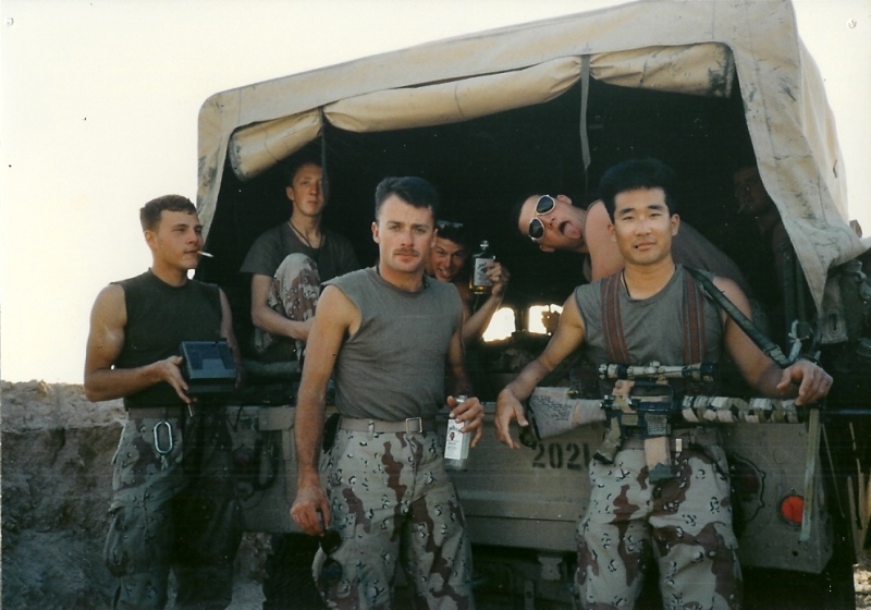 Group photo at the back of the Humvee