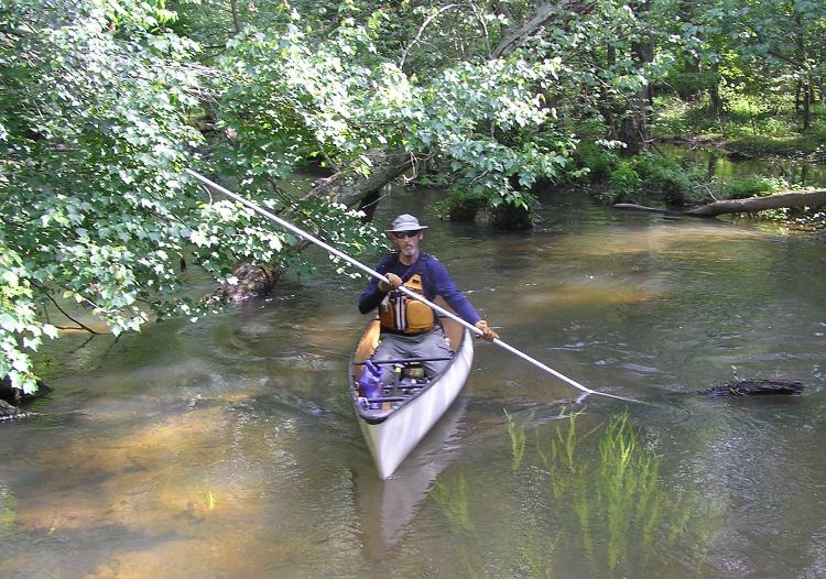 Chip canoeing with a long pole