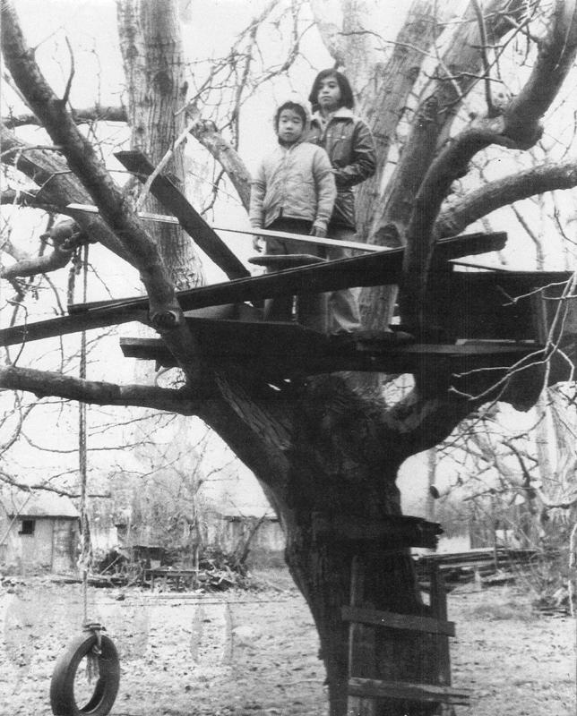 Cousin Paul and me in the treehouse at the farm