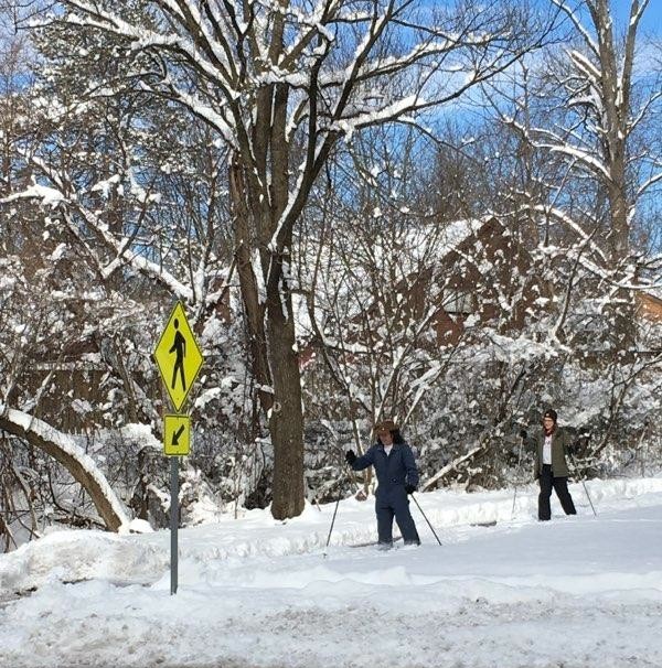 Norma and me near yellow sign that looks like skier