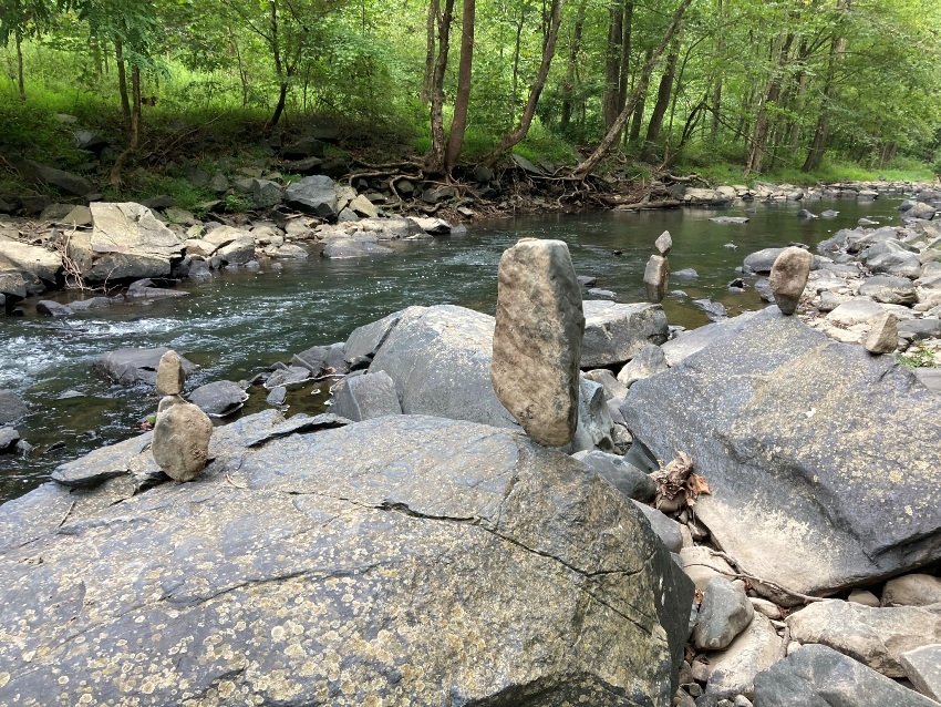 Several balanced rocks with Little Patuxent River in background