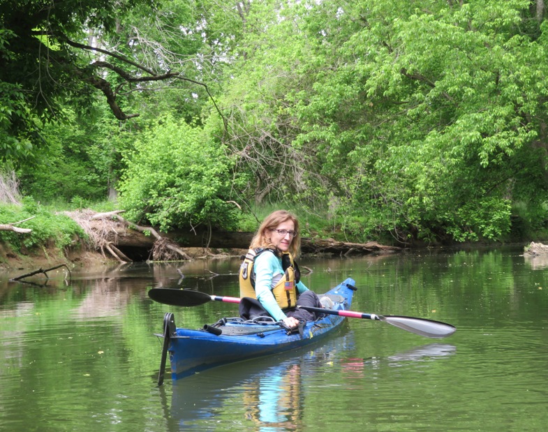 Norma in her kayak looking back