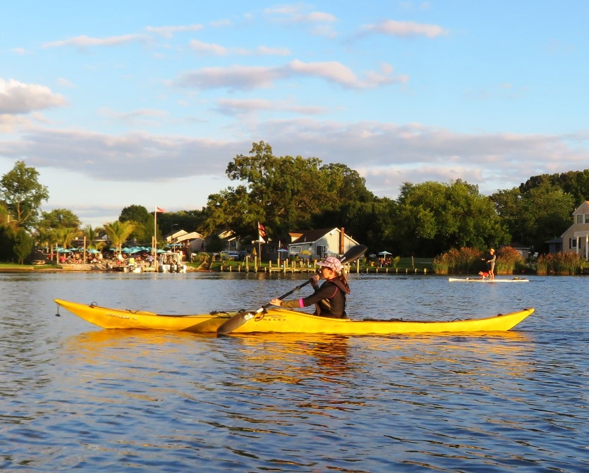 Sara kayaking with the Rams Head Dockside and me in the background