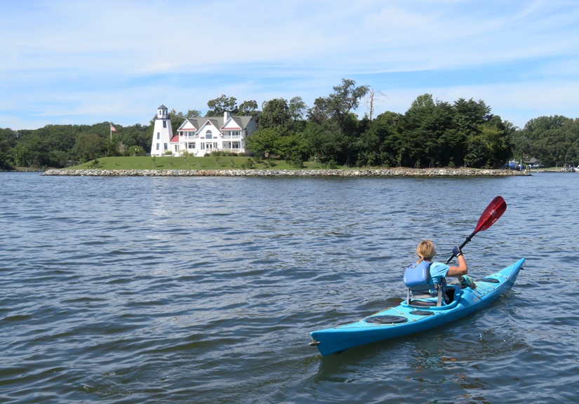 Linda kayaking towards lighthouse on Little Island