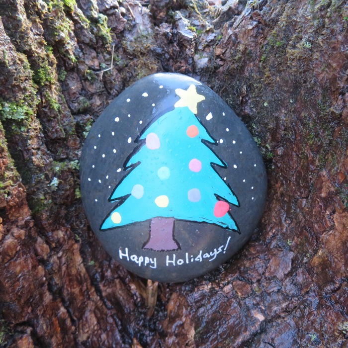 Painted rock in tree