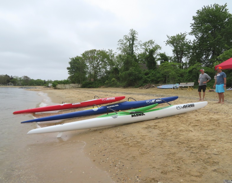 Several outrigger canoes on a beach