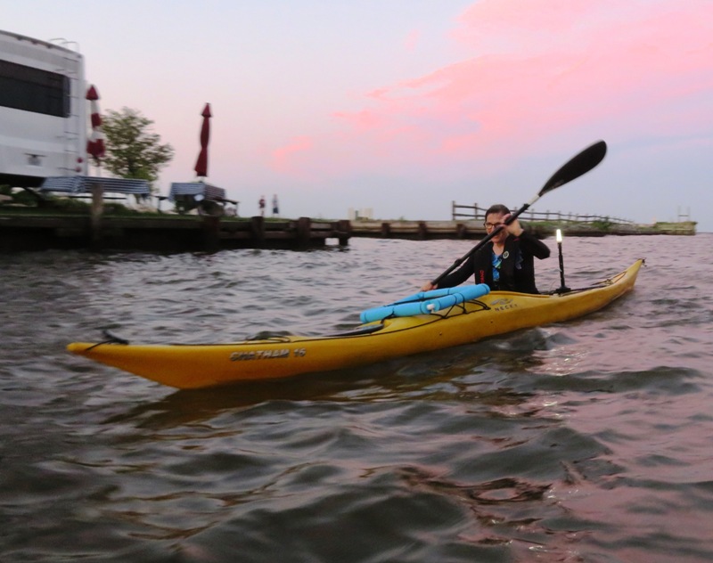 Sara kayaking back after dusk