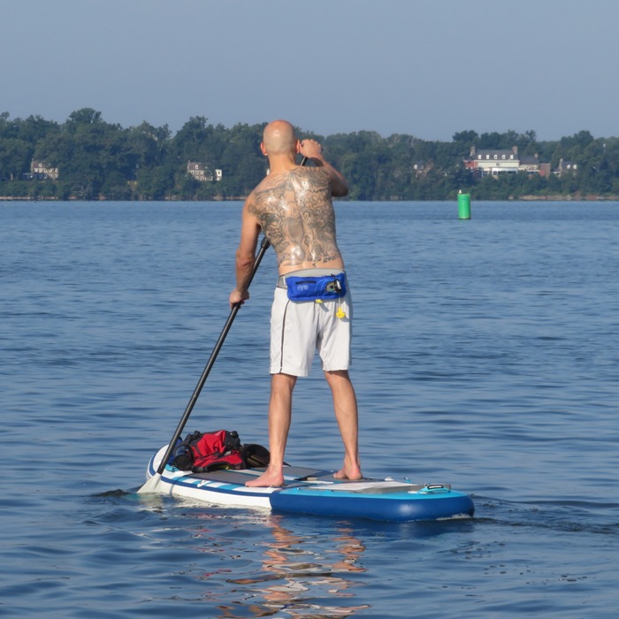 Richard paddleboarding on flat water