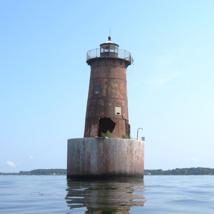 Other side of the lighthouse, showing a hole in the wall and the lighthouse leaning