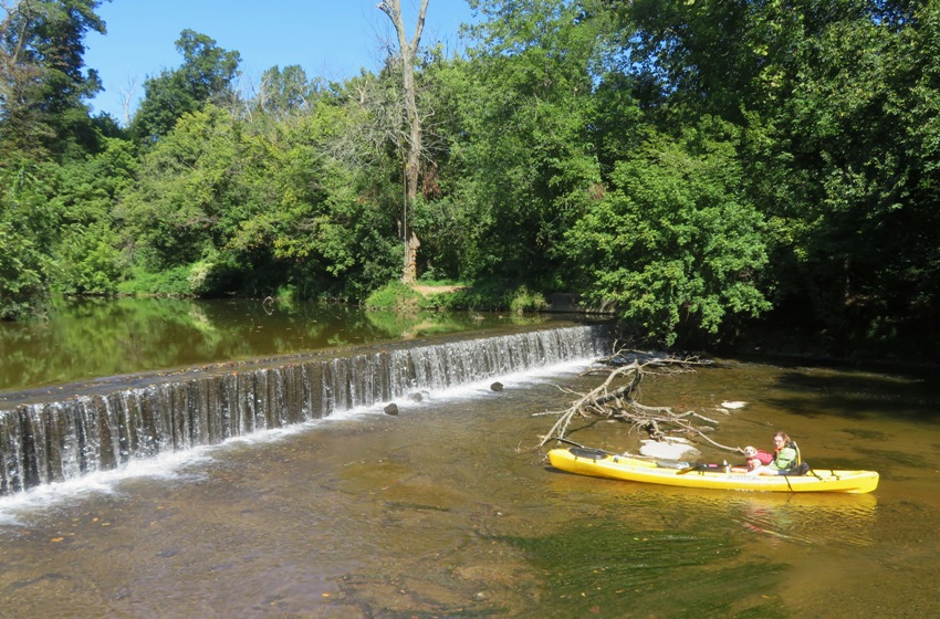 Norma and Daphne in kayak just downstream of dam