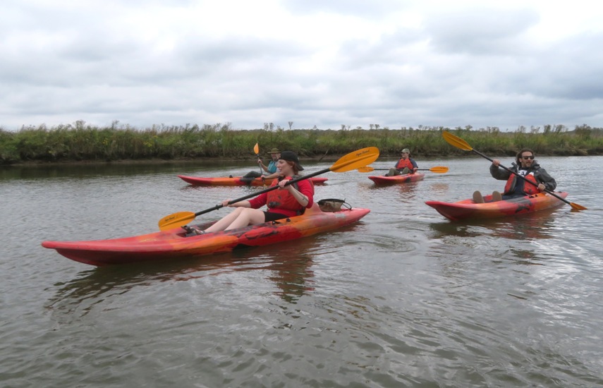 Four kayakers with Julie and Adam in the foreground