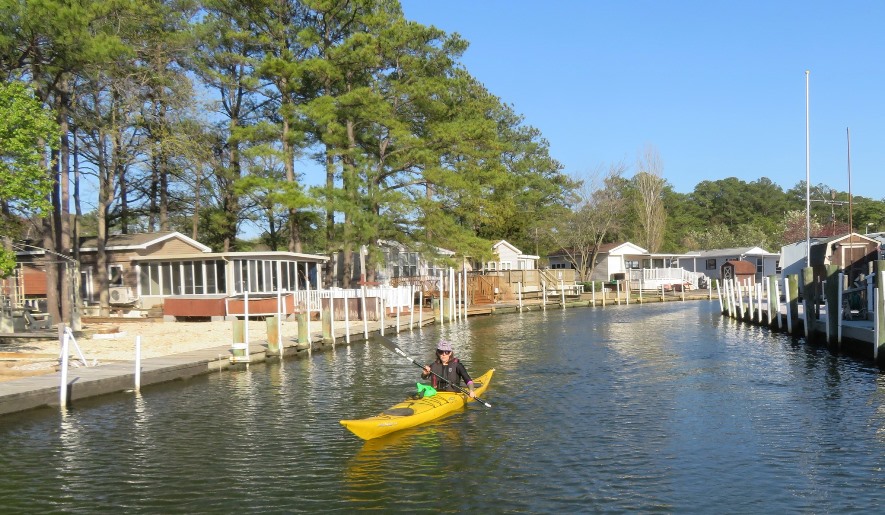 Sara kayaking through Beach Harbor Camper Co-Op