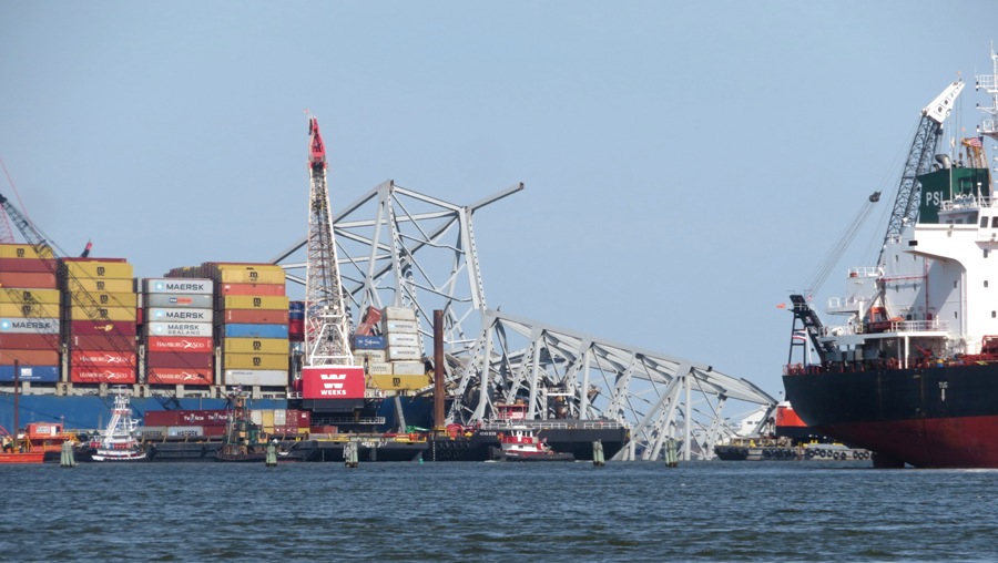 Bridge ruins on southwest side with tug boat in front