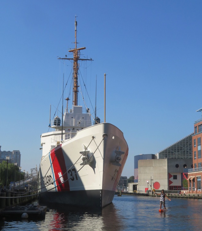 Ellison with paddle lifted by the Coast Guard Cutter 37