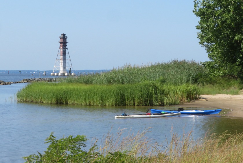 Lighthouse, beach, my SUP, and Norma's kayak