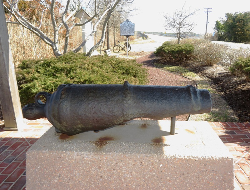 Rusty old cannon mounted on pedestal