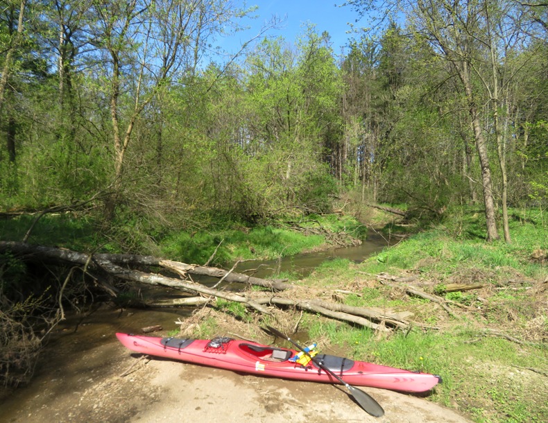 Kayak on sandy area with Witmer Run behind