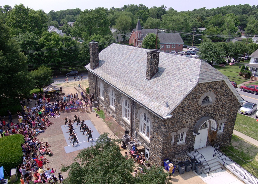 Dancers performing beside Carroll Baldwin Hall