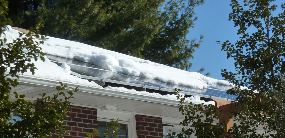 Snow on our house panels