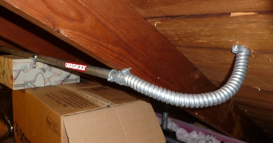 Electrical conduit in attic connecting to the panels